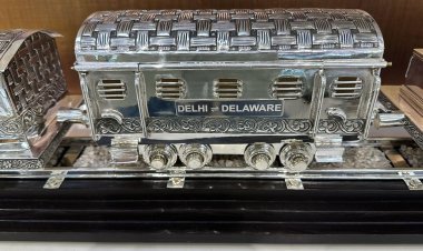 Prime Minister Modi presents President Biden with a silver, hand-engraved train model as a gift.